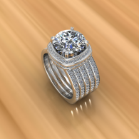Diamond ring with a round center stone and layered silver band on a warm wood surface