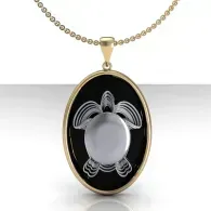 Gold pendant necklace with a black oval turtle charm on a white background