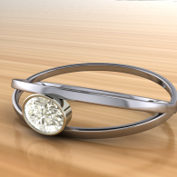 Silver bracelet with an oval gemstone clasp on a light wooden surface