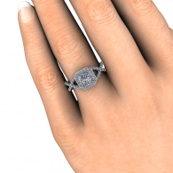 Close-up of a hand wearing a silver diamond ring on the ring finger