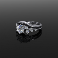 Silver diamond engagement ring on a glossy black surface