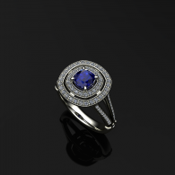 Silver ring with a large blue gemstone and halo of small diamonds on a black background