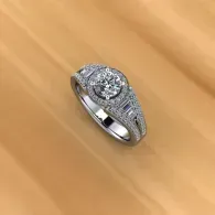 Silver diamond ring on a wooden surface.
