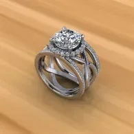Silver ring with a cluster of clear stones on a wooden surface