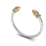 Gold and silver twisted cable bracelet with gemstone accents on a white background