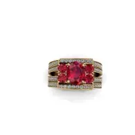 Rectangular gold ring with two red gemstones and pavé side stones