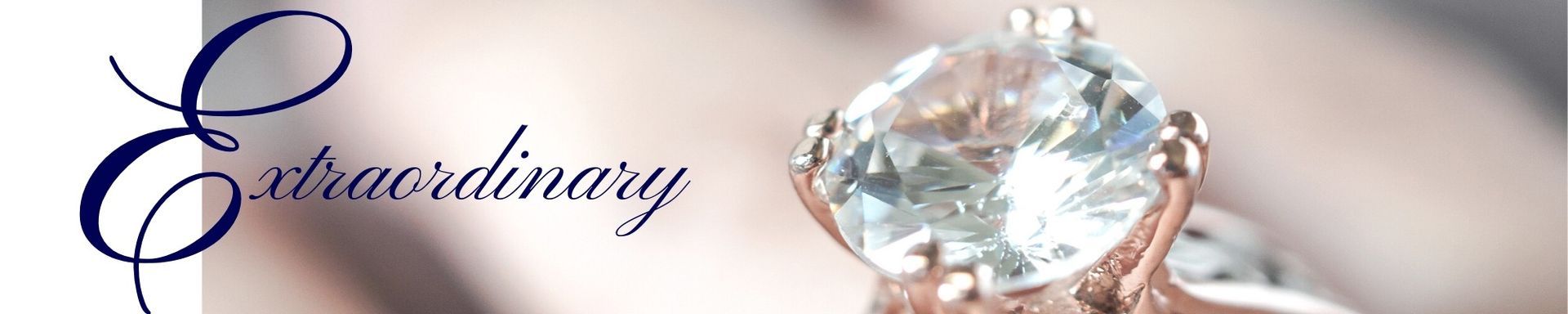 “Extraordinary” cursive logo beside a sparkling diamond ring on a pale background