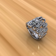 Silver rhinestone spiral ring on a warm wooden surface