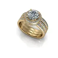 Gold ring with a large round diamond and smaller side stones on a white background