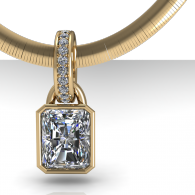 Gold pendant with a rectangular diamond on a gold chain, shown against a white background