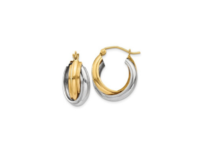 Gold and silver hoop earrings on a white background