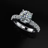 Diamond solitaire engagement ring with pavé band on a black background