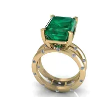 Gold ring with a large square green gemstone and small diamond accents