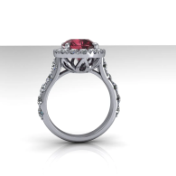 Silver ring with a red gemstone in an ornate setting, shown side view on a white background