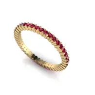 Gold ring with red stones in a circular pattern