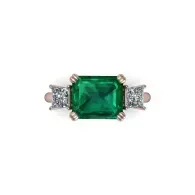 Emerald-cut green gemstone ring with side diamonds on a white background