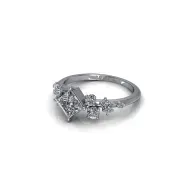 Silver diamond ring with a square center stone on a white background