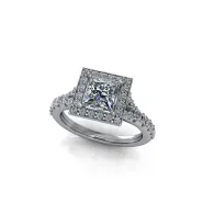 Silver square-cut diamond engagement ring with side stones on a white background