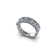 Silver ring with a row of clear rectangular gemstones on a white background