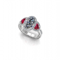 Silver ring with blue and red gemstones on a white background