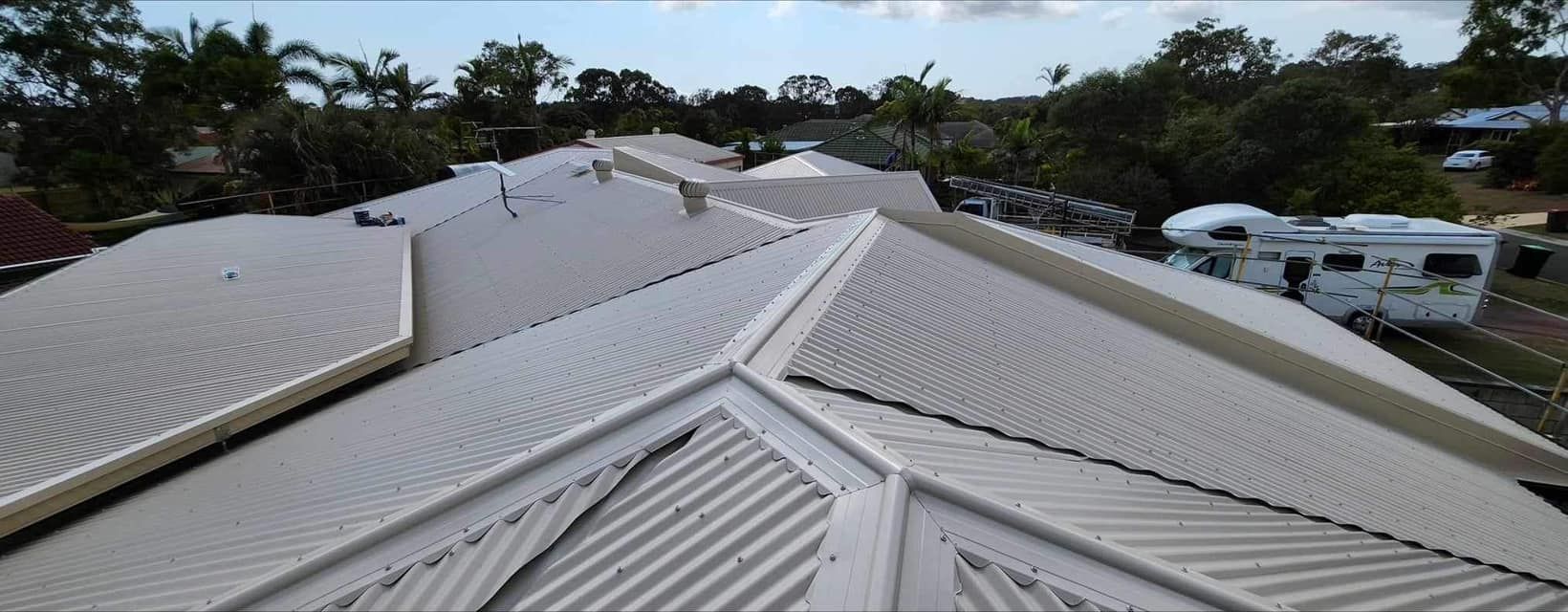 Overhead View of a Light-colored Metal Roof on a Building — Over the Top Roofing Specialists in Caloundra, QLD