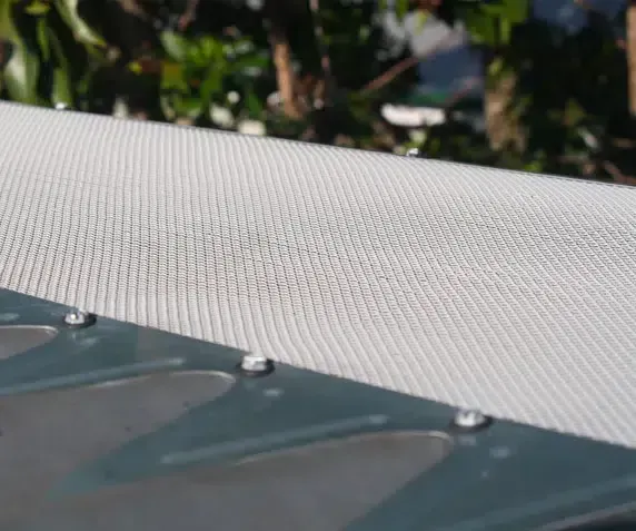 Close-up of a White Mesh Screen Attached With Rivets — Over the Top Roofing Specialists in Kunda Park, QLD