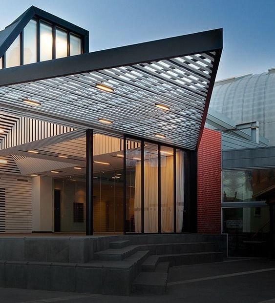 Modern Building Entrance With Sloped Canopy — Over the Top Roofing Specialists in Kunda Park, QLD