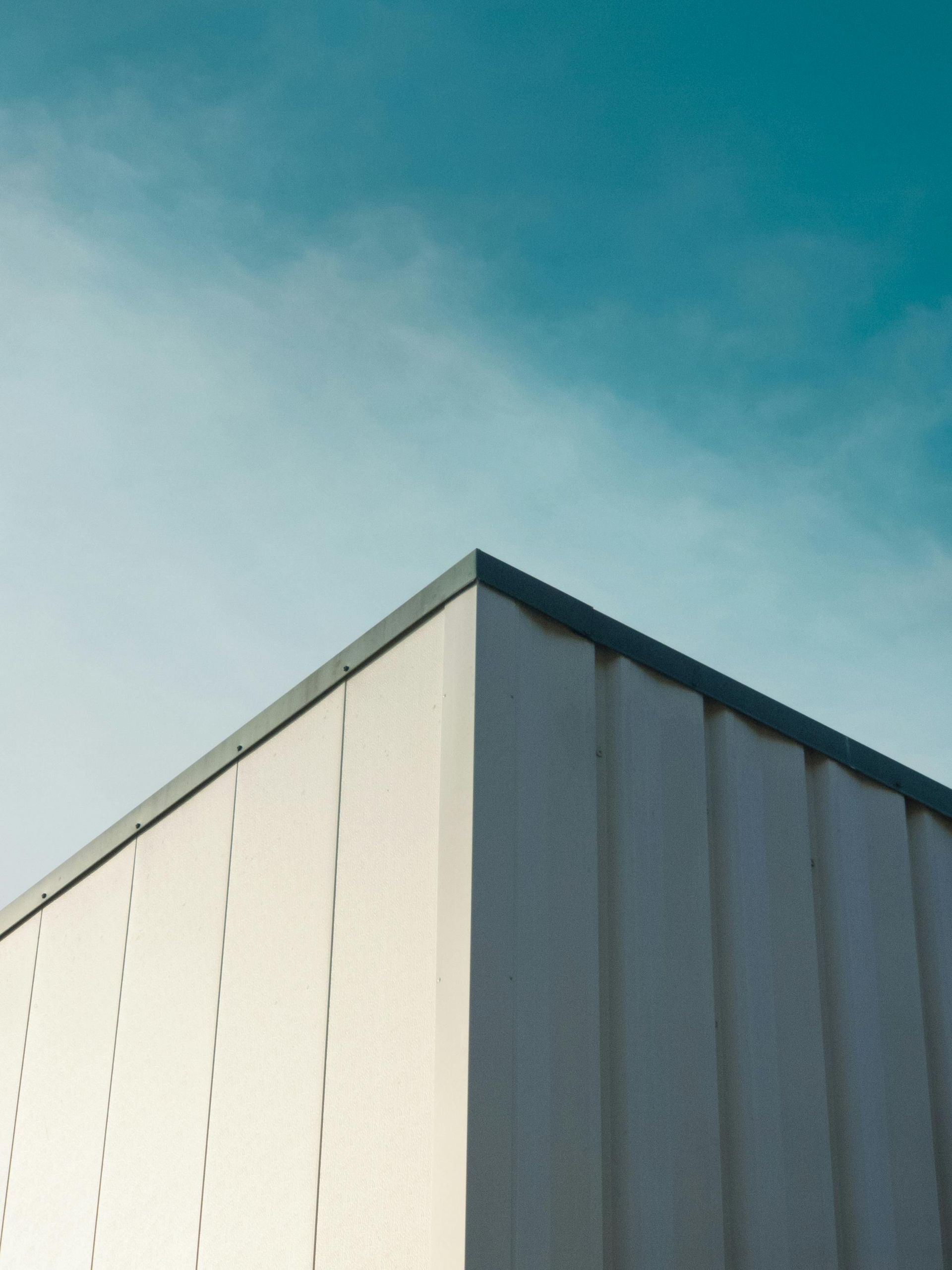 White building corner against a blue sky