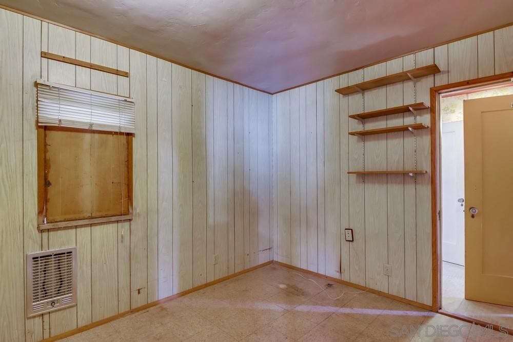 There is a window in the corner of the room.