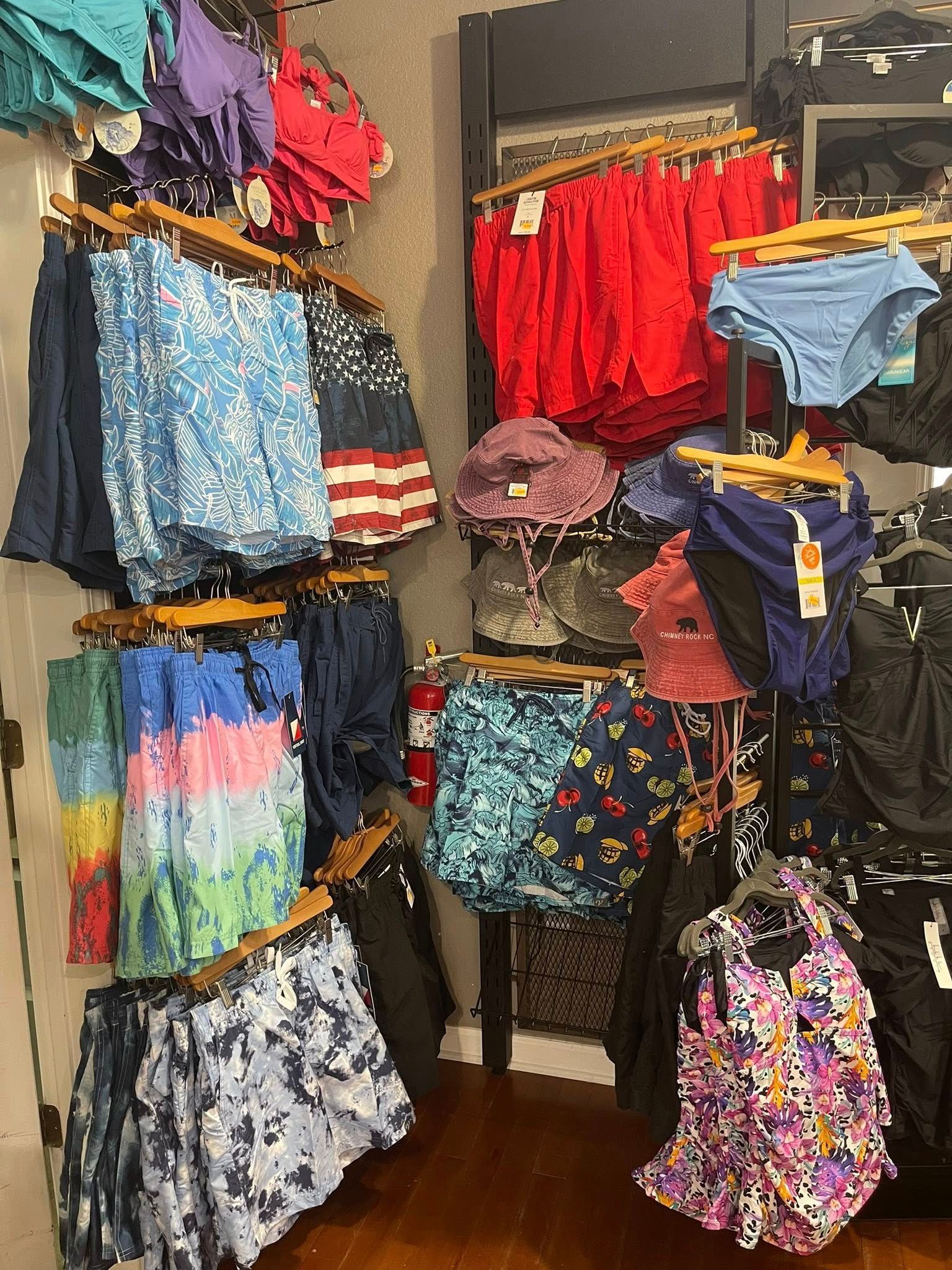 Welcoming mountain gift shop display with apparel and souvenirs inspired by Chimney Rock and Lake Lure.