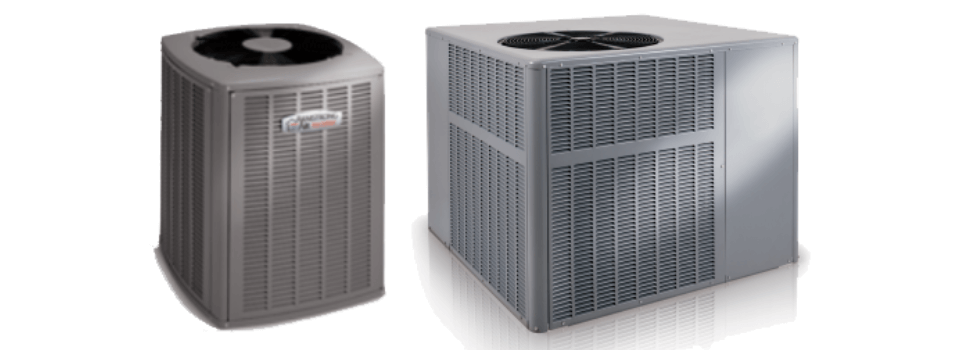 Two air conditioners are sitting next to each other on a white background.