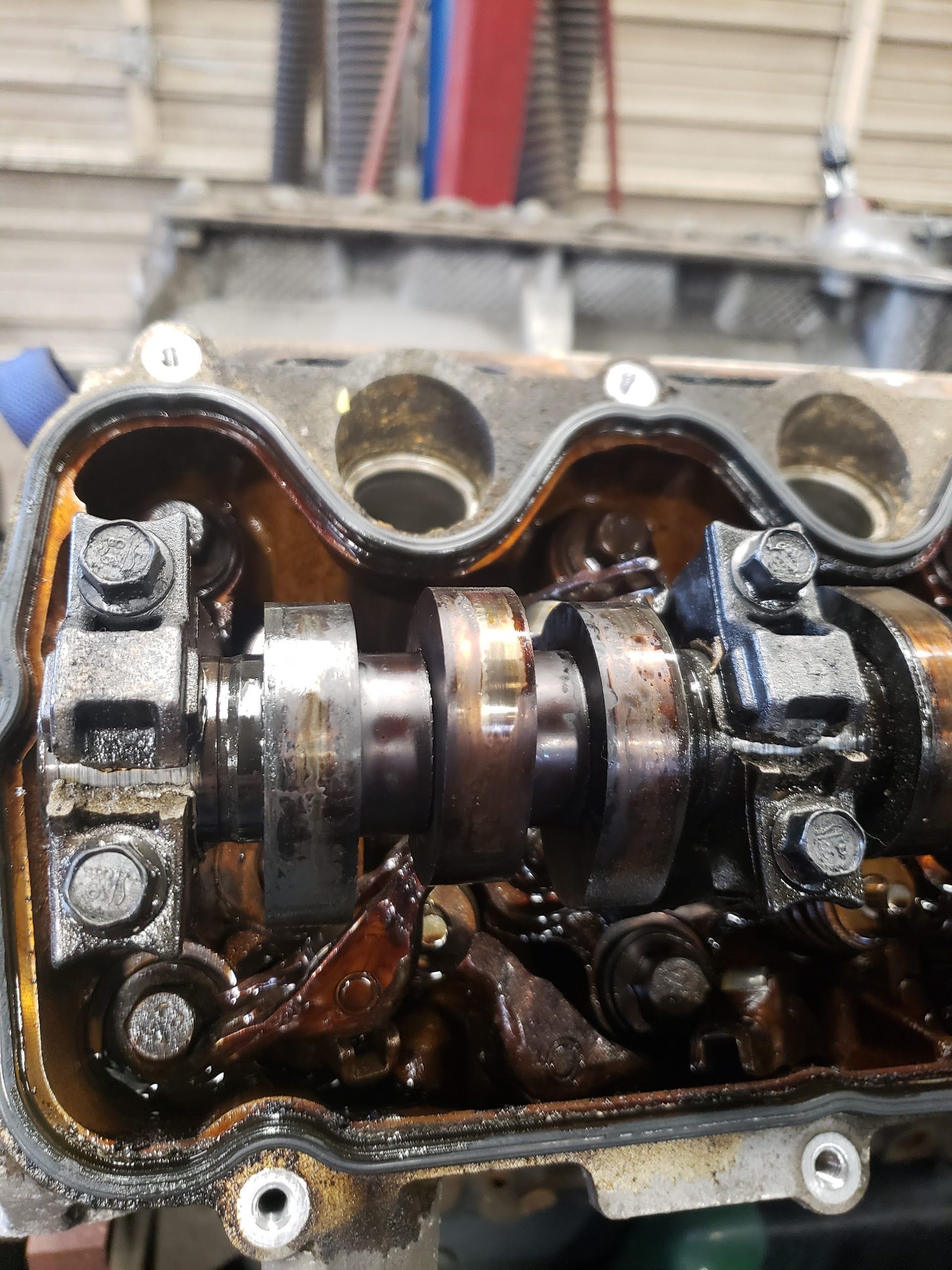Engine valve train components inside an engine, covered in oil | Gateway Automotive Inc.