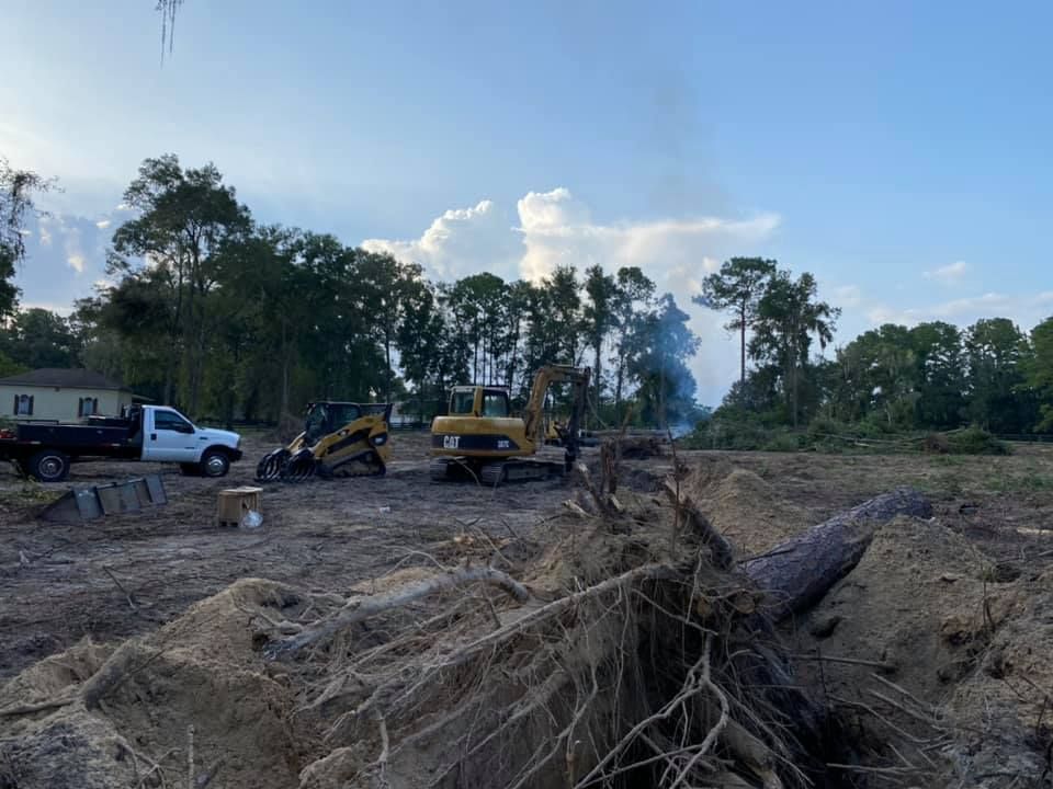Truck next to excavator - link to Services