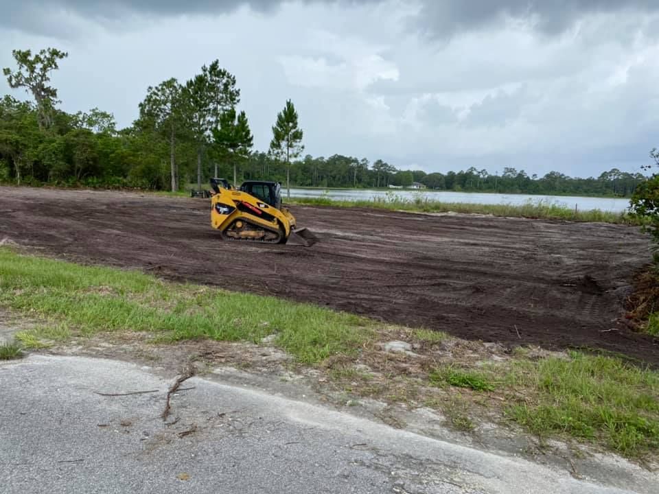 Yellow bulldozer is working on a dirt field - link to Contact Us