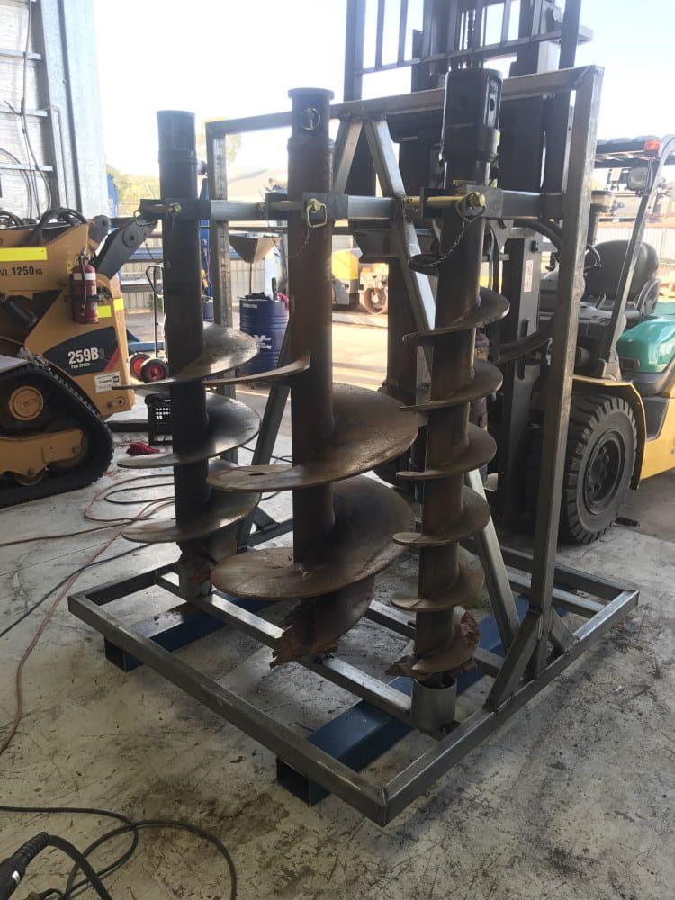 A Forklift is Sitting Next to a Pile of Drill Bits — RK Diesel Services in Ciccone, NT