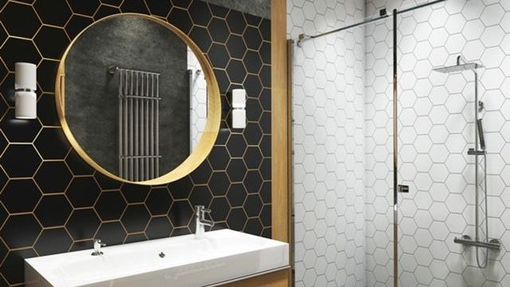 A bathroom with a sink , mirror and shower.