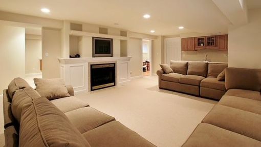 A living room filled with furniture and a fireplace.