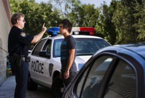 Police office administering a sobriety test