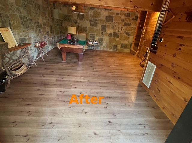 Empty room with wood floor, stone wall, small table, and orange “After” text.