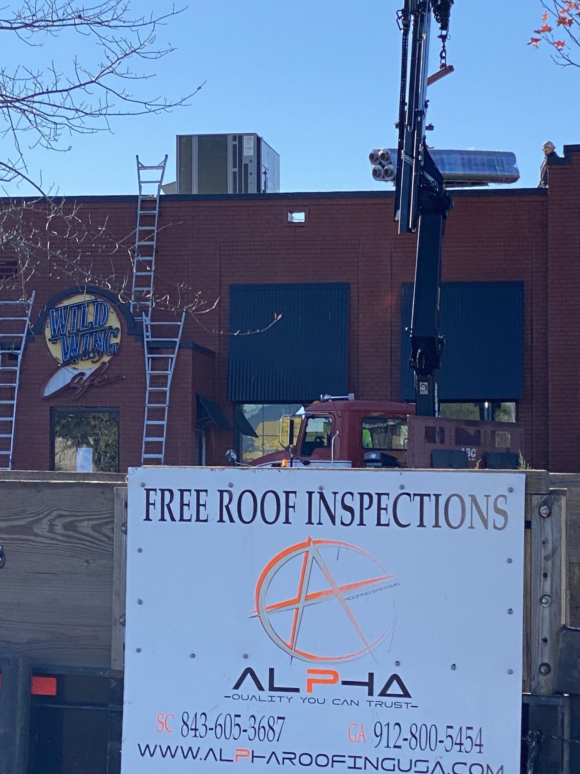 Displays A Sign For A Roofing