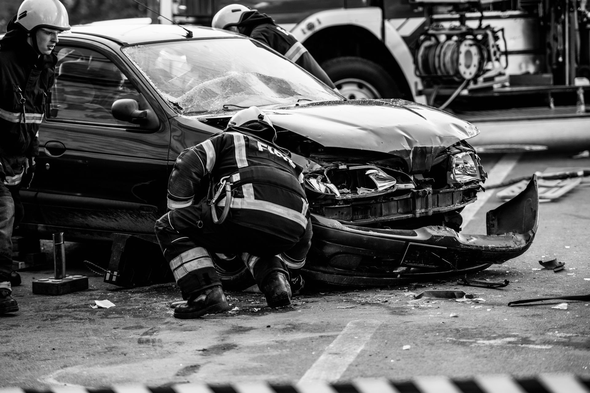 Car accident scene with firefighters assisting after a crash in Klamath Falls, OR 