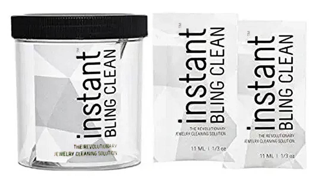 Two jars of Instant Bling Clean skincare product, one large and one travel-size, on a white background