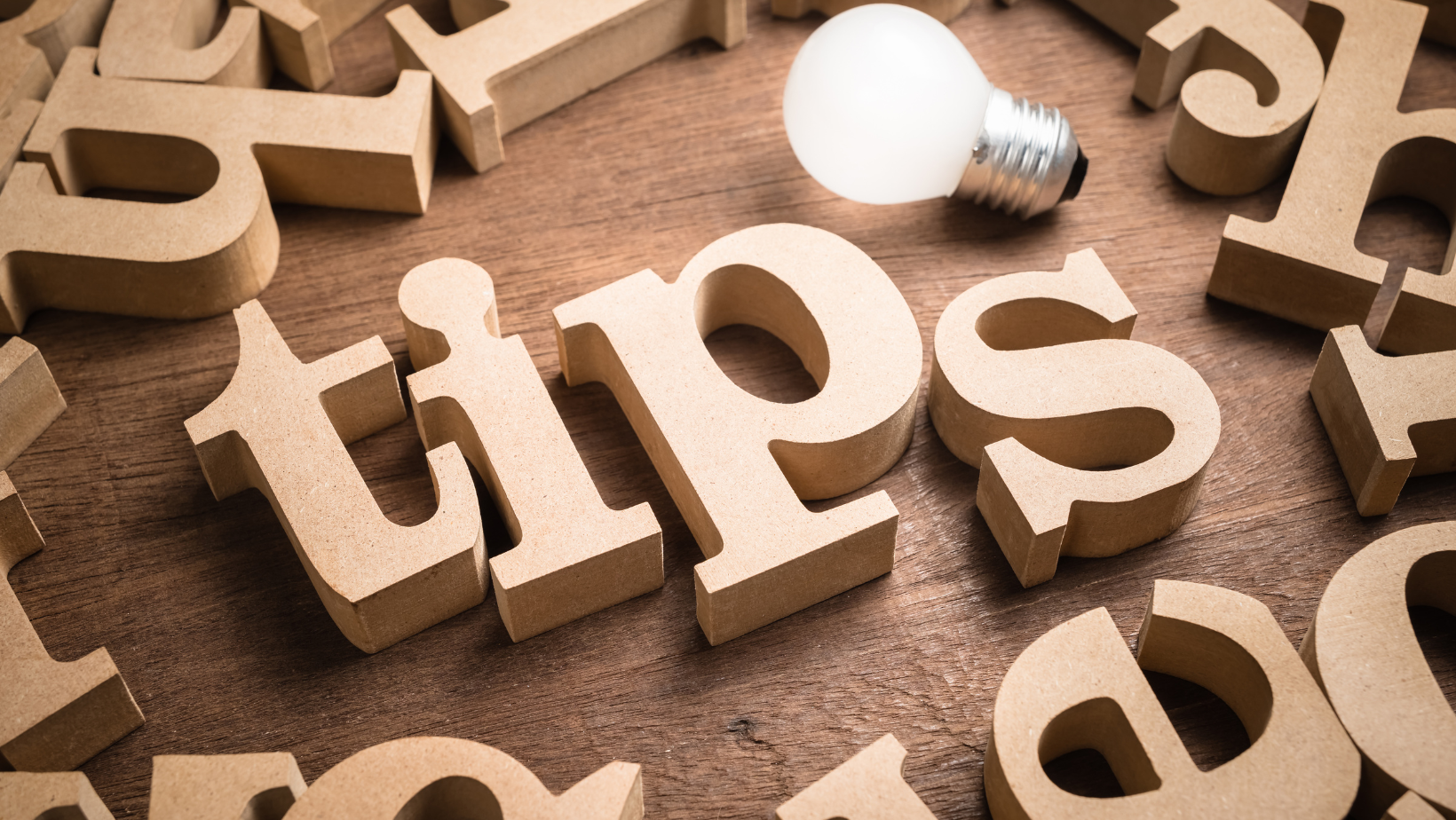 The word tips is spelled out in wooden letters with a light bulb.