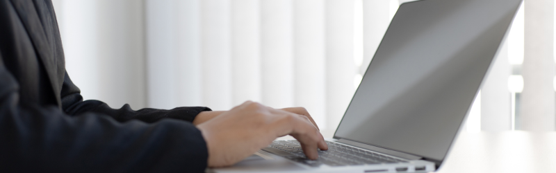 Business owner managing their online Reputation on a laptop.