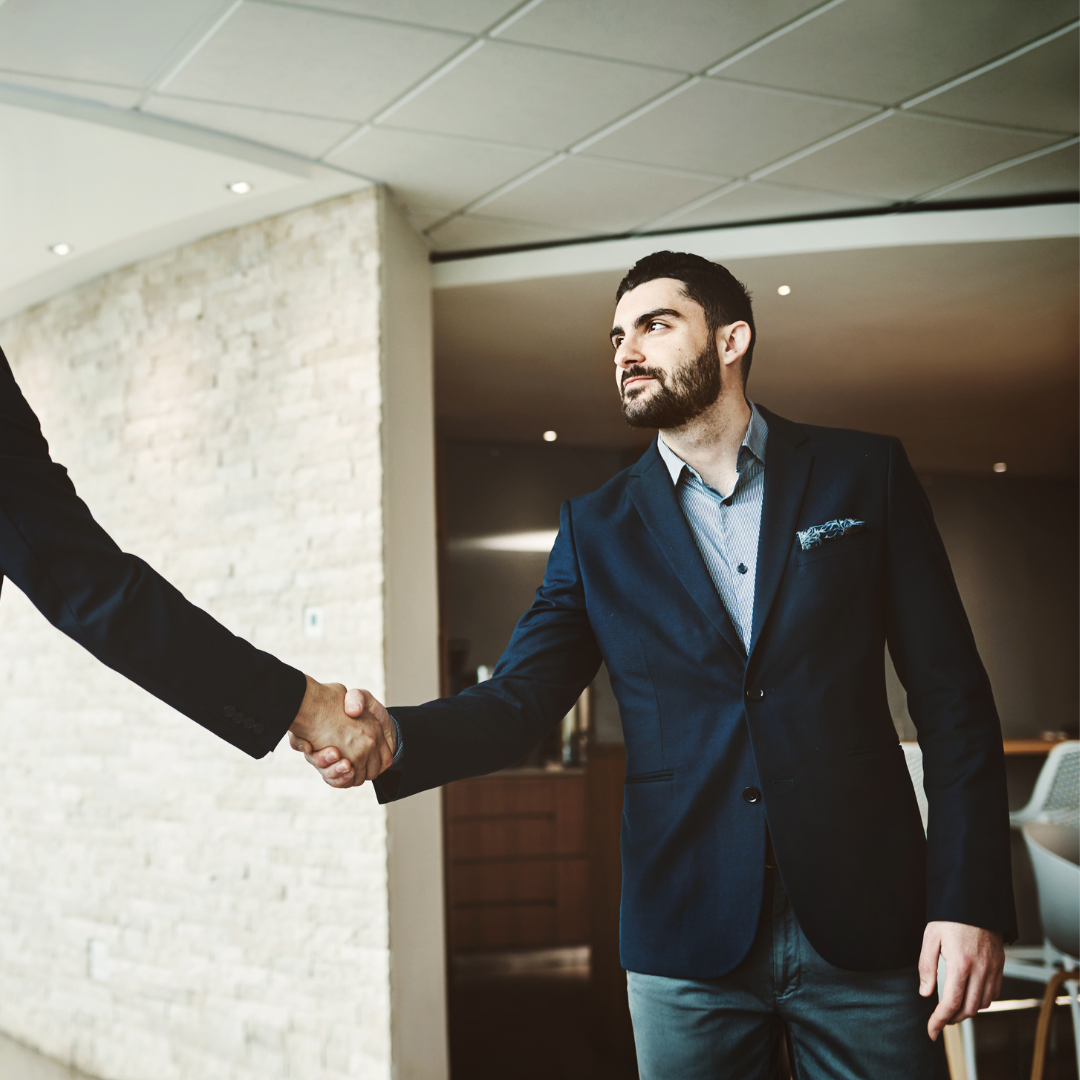 A person shaking hands with another person.