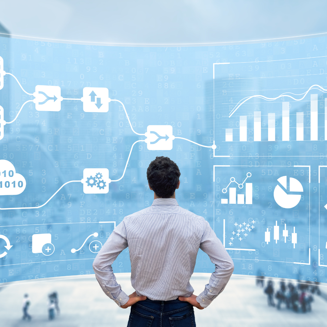 A person looking at a screen with graphics depicting data.