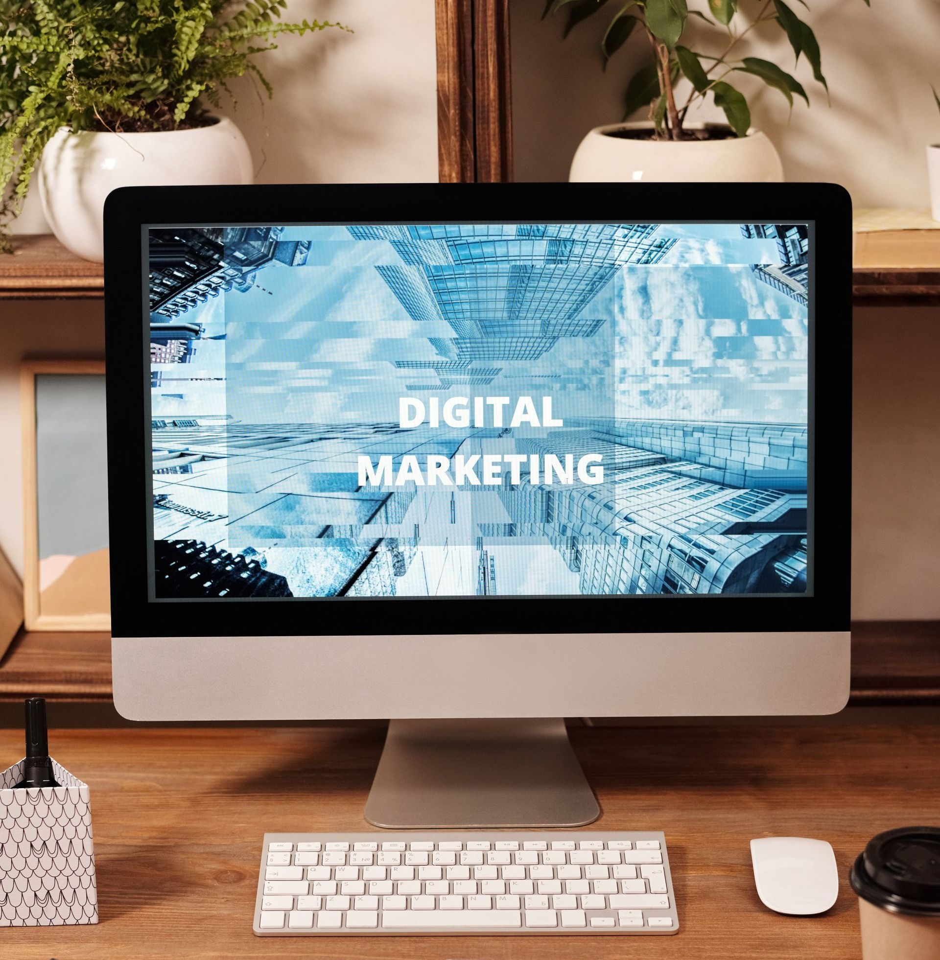 A monitor on a desk with the words Digital Marketing on the screen.