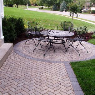 There is a table and chairs on the patio.