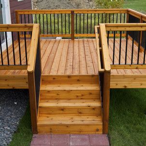 A wooden deck with stairs leading up to it.