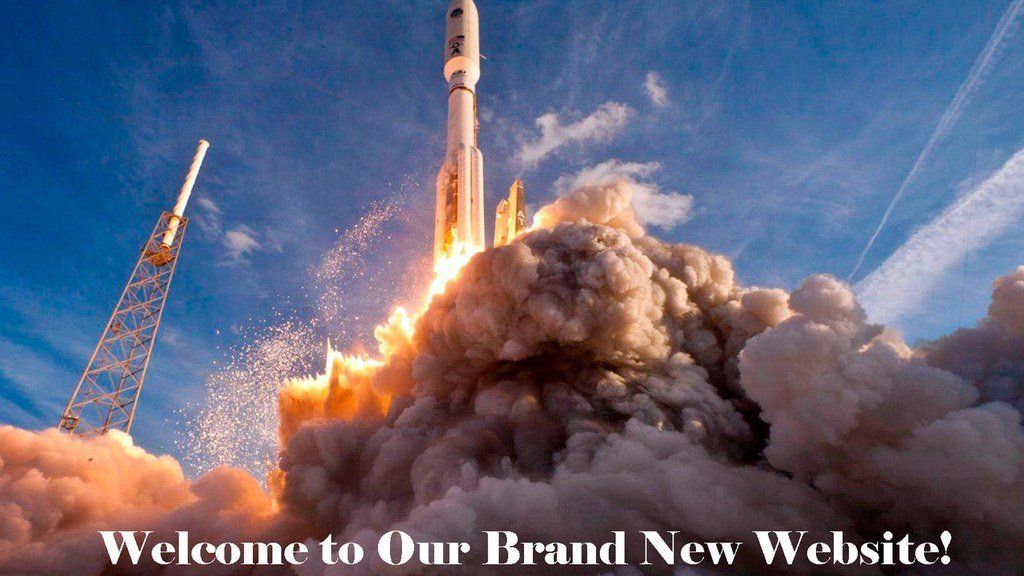Rocket launch at dawn with billowing smoke and text: “Welcome to Our Brand New Website!”